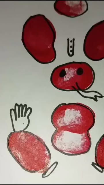 Fingerprint-painted apples artwork by children